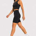 Side view of black cycling shorts on model walking