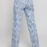 Blue floral pants worn by a person on a gray background