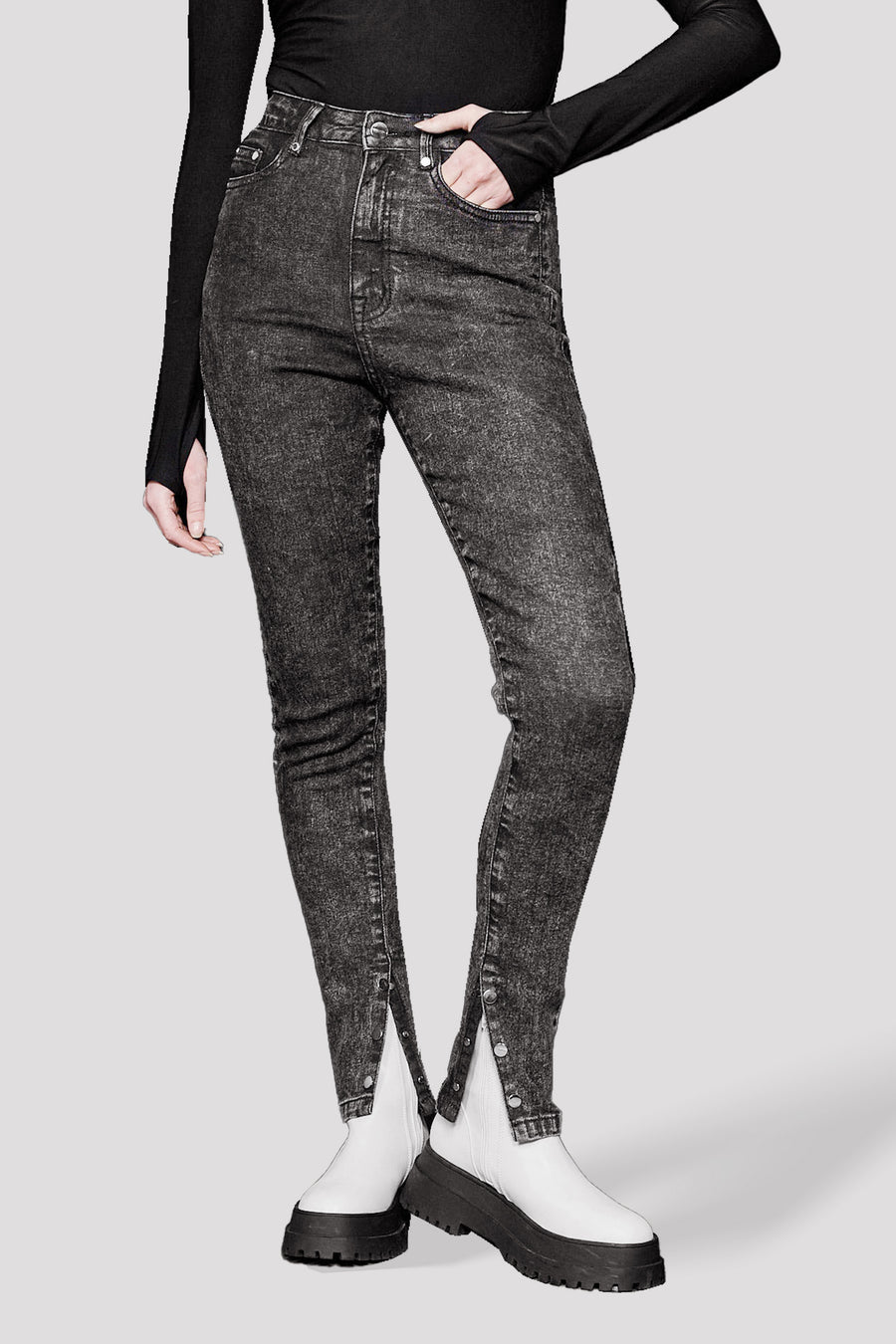 HIGH RISE SKINNY JEANS WITH HEM POPPER DETAIL - BLACK ACID WASH