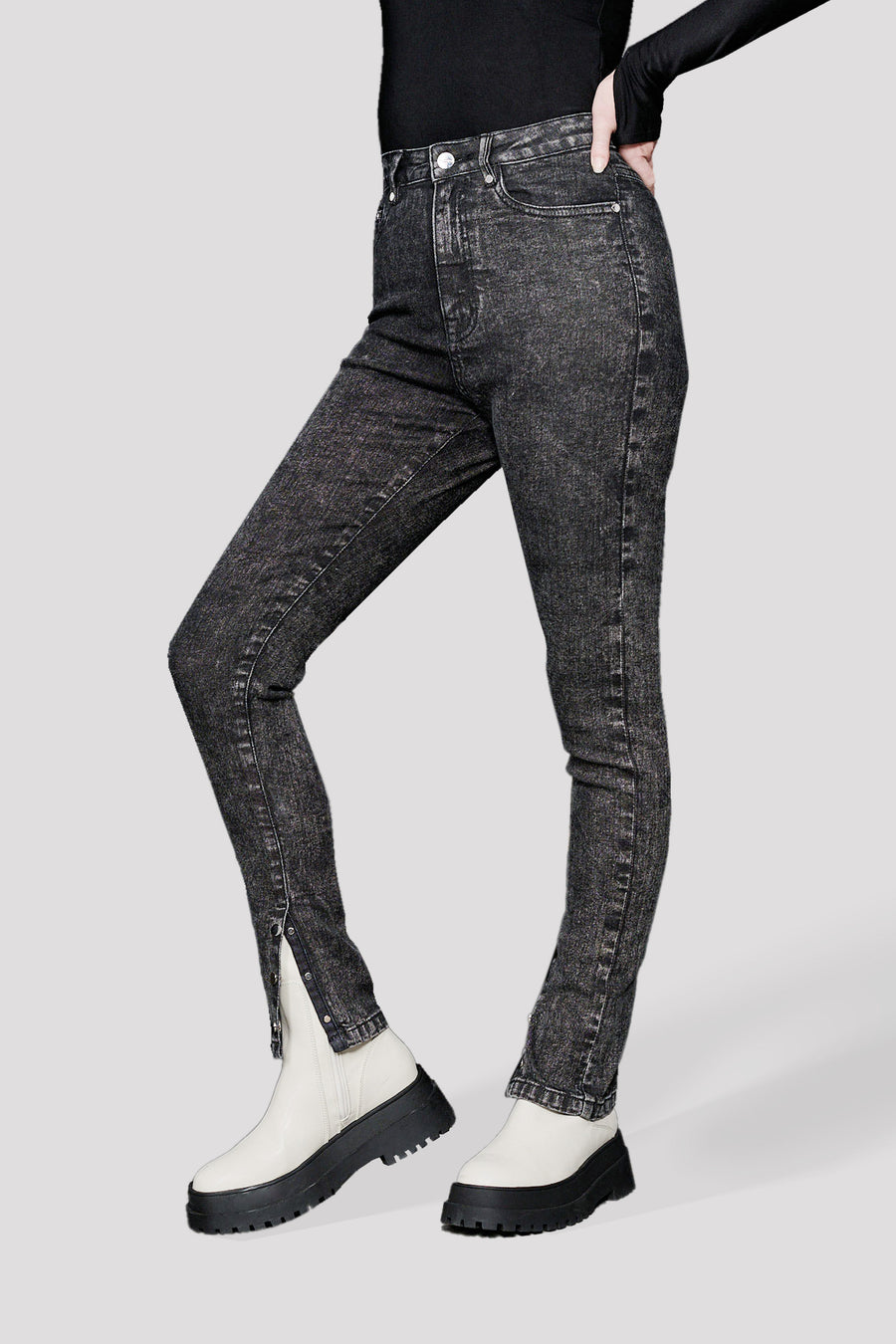 HIGH RISE SKINNY JEANS WITH HEM POPPER DETAIL - BLACK ACID WASH