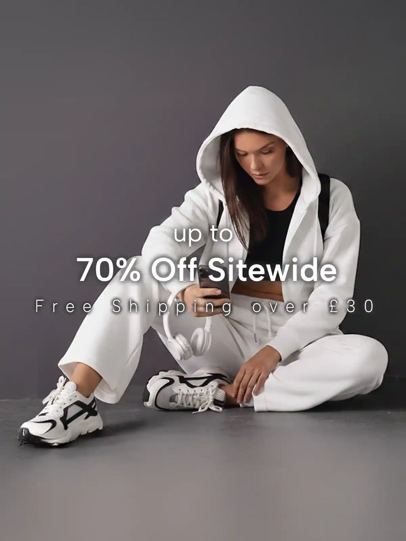 A women wearing hoodie and jogger using cellphone