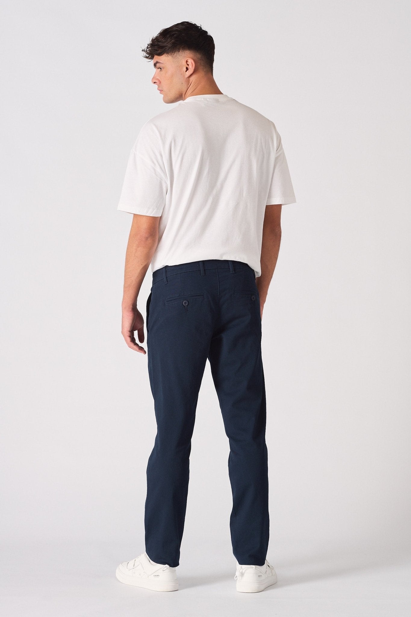 Full back view of the navy blue chinos slim fit showing the cut.