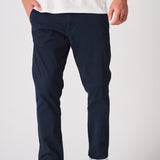 Close up of the leg and fit of navy blue chinos slim fit.