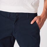 Close up view of the front pocket on navy blue chinos slim fit.