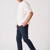 Stylish male model wearing navy blue chinos slim fit.