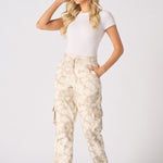 Front view of a woman posing in cuffed cargo joggers with patch pockets