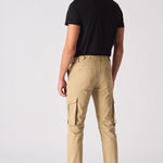 Rear view of a man wearing beige cotton cargo pants with visible back pockets.