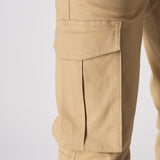 Close up of the side cargo pocket and stitching on the beige cotton cargo pants.