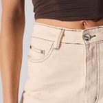 Beige jeans with a plain background