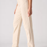 Beige pants worn by a person on a plain background