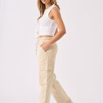 Side profile of a model walking in comfortable beige straight leg cargo pants.