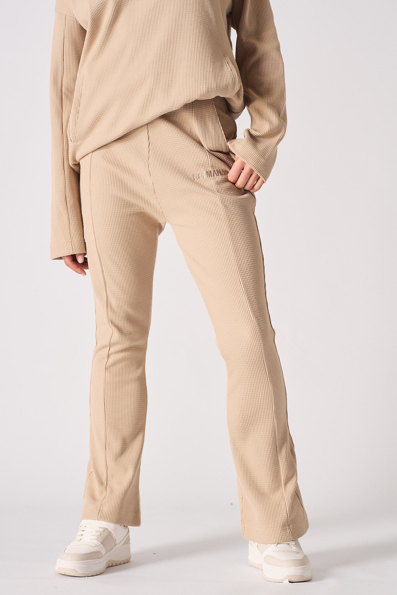 Beige waffle flared joggers fabric texture detail