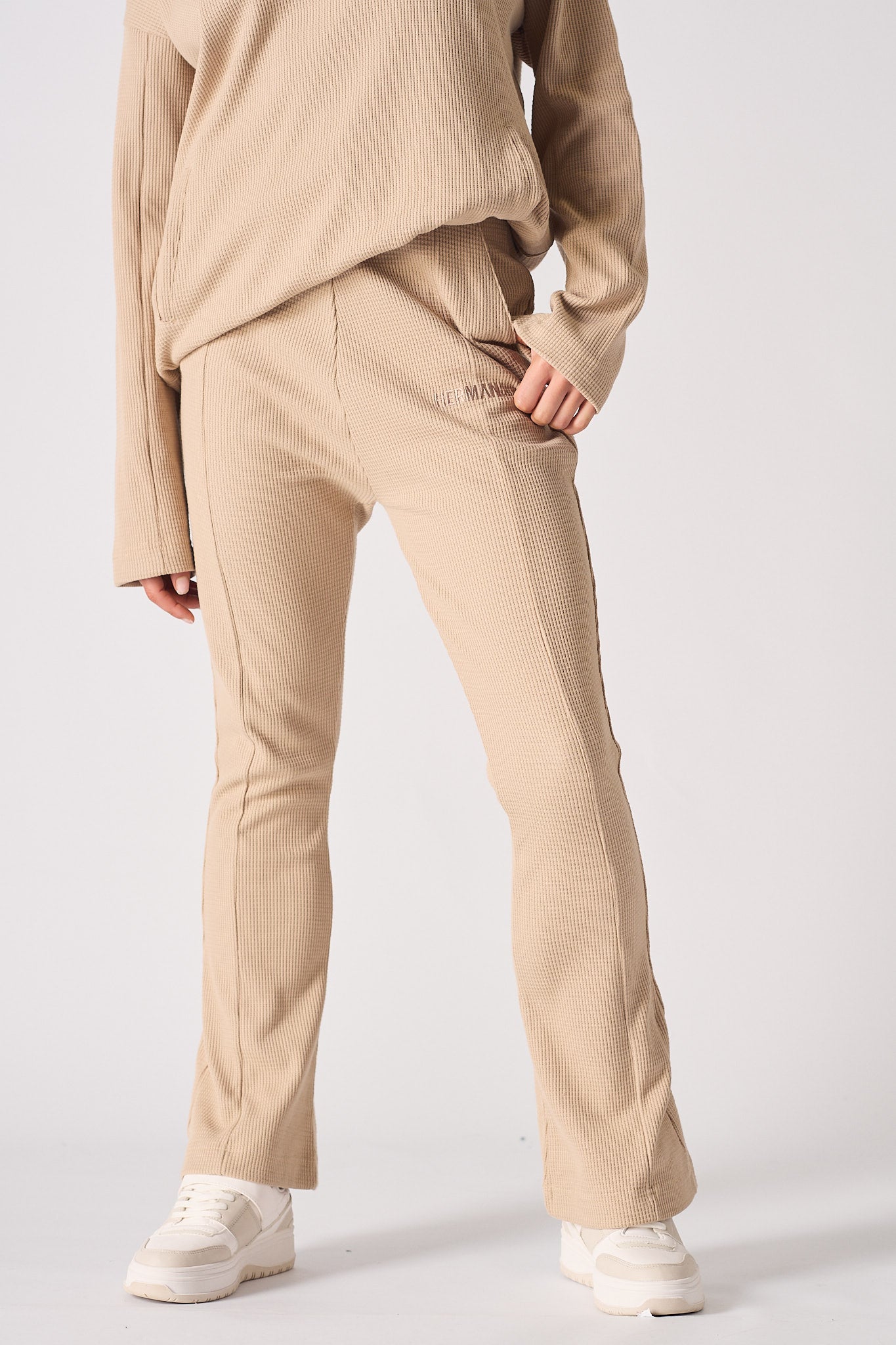 Beige waffle flared joggers fabric texture detail