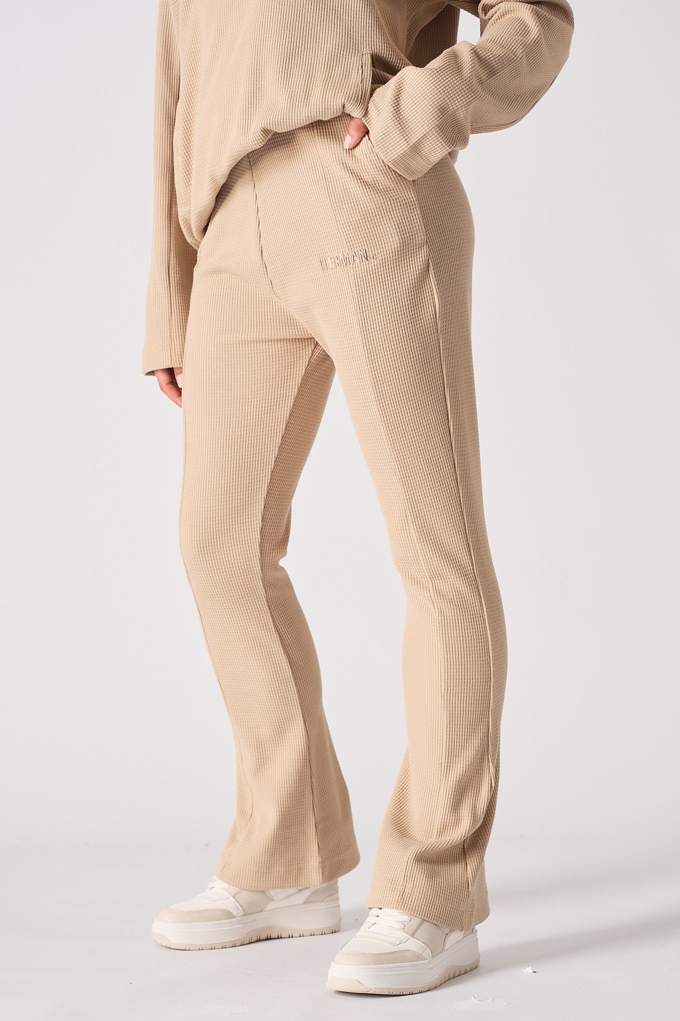 Beige waffle flared joggers front view