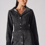 Close-up of the belted acid wash denim dress, focusing on the stitched belt and buttons