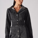 Close-up of the belted acid wash denim dress, focusing on the stitched belt and buttons