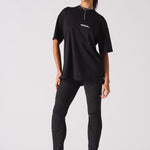 black biker jeans for women styled with oversized t-shirt full look