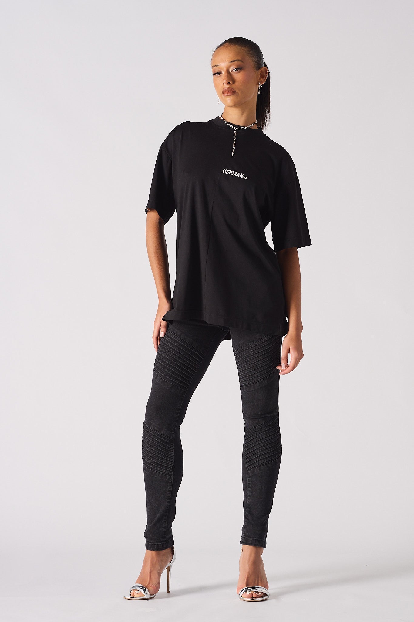 black biker jeans for women styled with oversized t-shirt full look