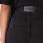 black biker jeans women back pocket vegan leather logo patch detail