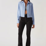 Side profile view of women's black bootcut jeans highlighting the form-fitting shape