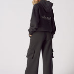 Rear view of black wide leg cargo joggers showing the comfortable silhouette