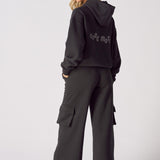 Rear view of black wide leg cargo joggers showing the comfortable silhouette