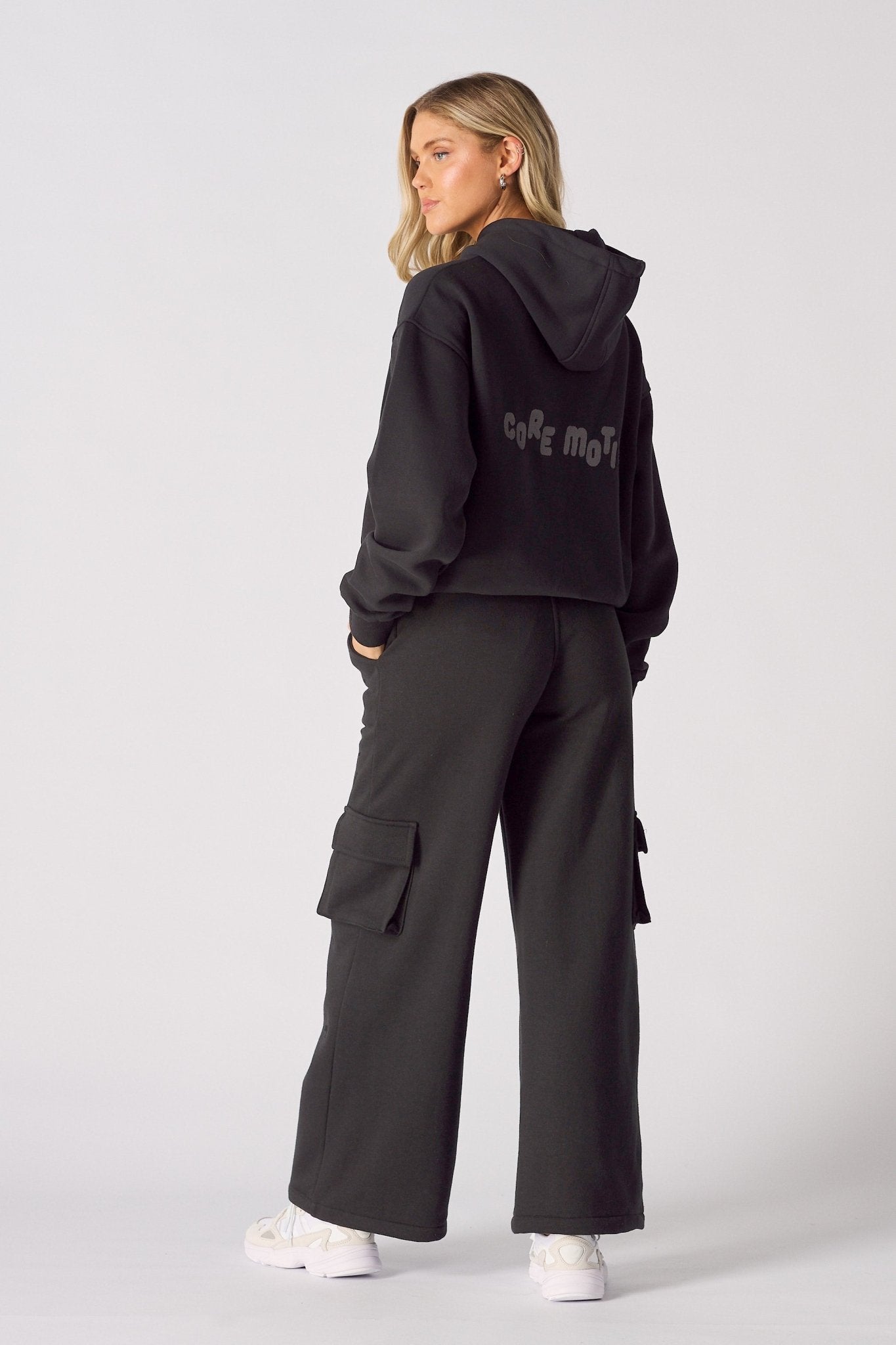 Rear view of black wide leg cargo joggers showing the comfortable silhouette