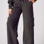 Front view of black wide leg cargo joggers for women with a relaxed fit