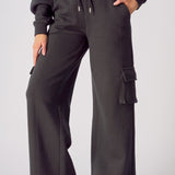 Front view of black wide leg cargo joggers for women with a relaxed fit