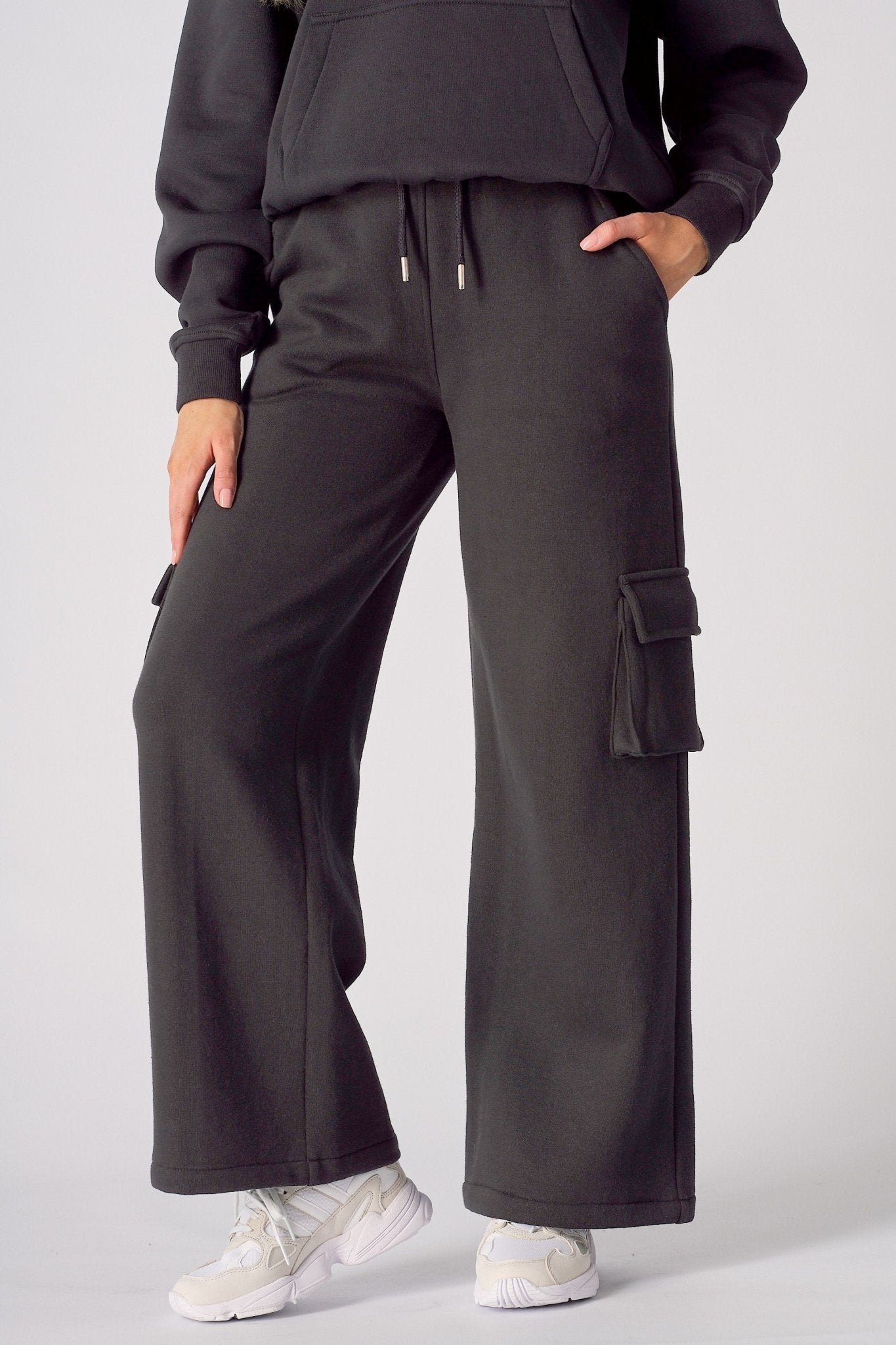 Front view of black wide leg cargo joggers for women with a relaxed fit