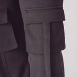 Detail shot of the leg and fit on black cargo trousers womens straight leg.