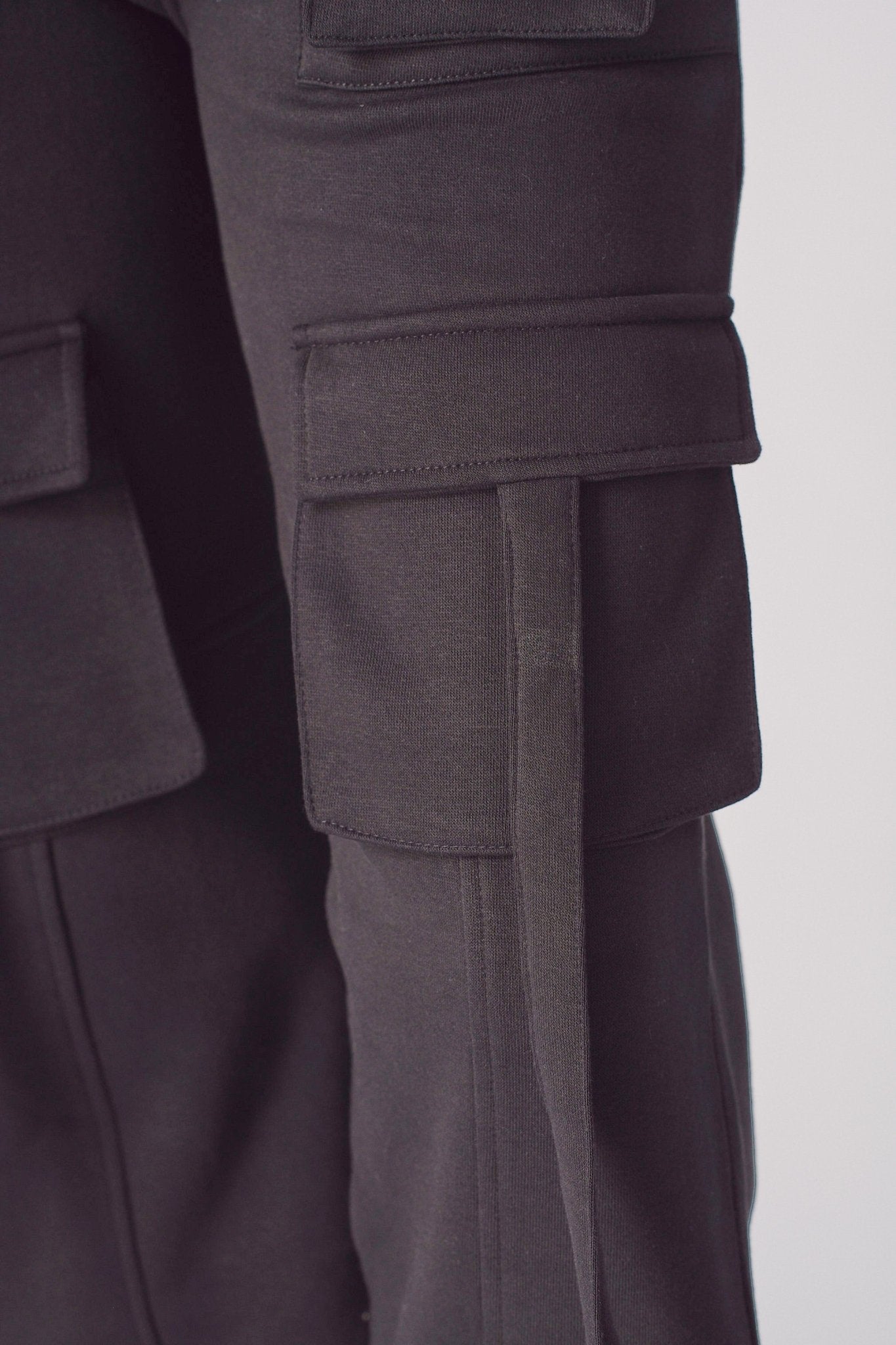 Detail shot of the leg and fit on black cargo trousers womens straight leg.