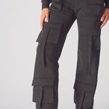 A model walking in comfortable black cargo trousers womens straight leg.