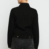 Full back view of black denim trucker jacket for women showing clean design and button detail at hem
