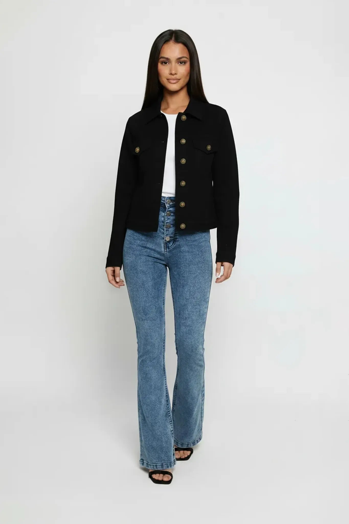 Full front view of women's black denim trucker jacket with button front closure - regular fit cotton jean jacket