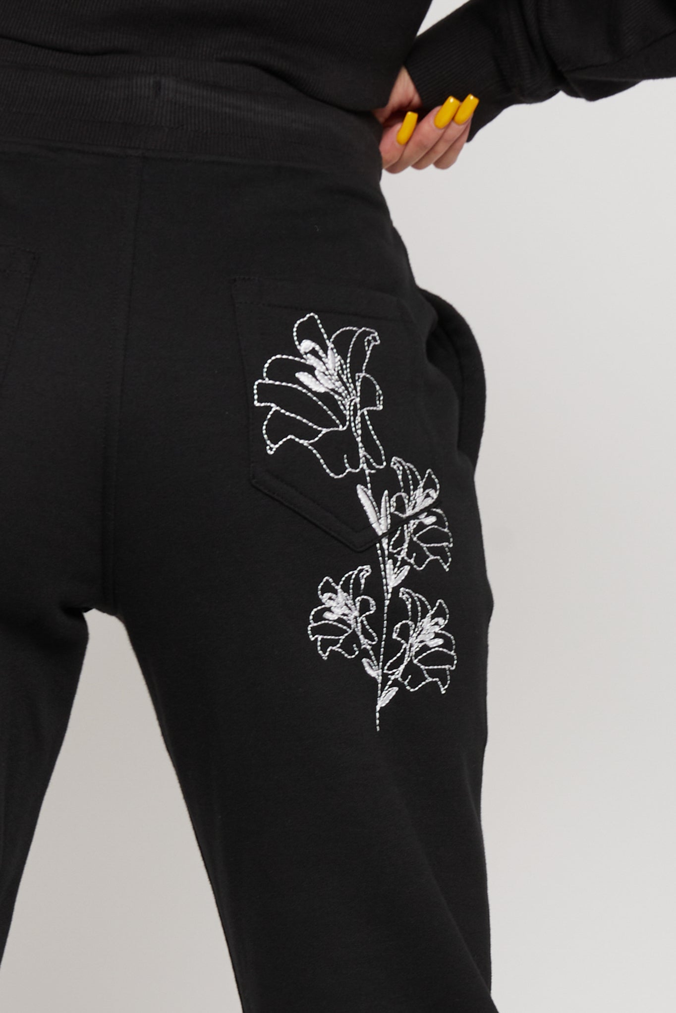 Black embroidered tapered joggers floral embroidery detail