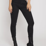 Person wearing black high-waisted jeans and black knee-high boots on a white background