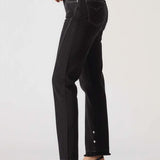Person wearing black jeans on a white background