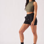 Side profile view of a model styling comfortable black jogger shorts