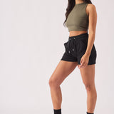 Side profile view of a model styling comfortable black jogger shorts