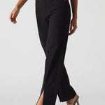 Black pants with silver accents worn by a model on a white background