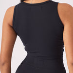 Detailed shot of the back profile and neckline of a black racer neck crop top