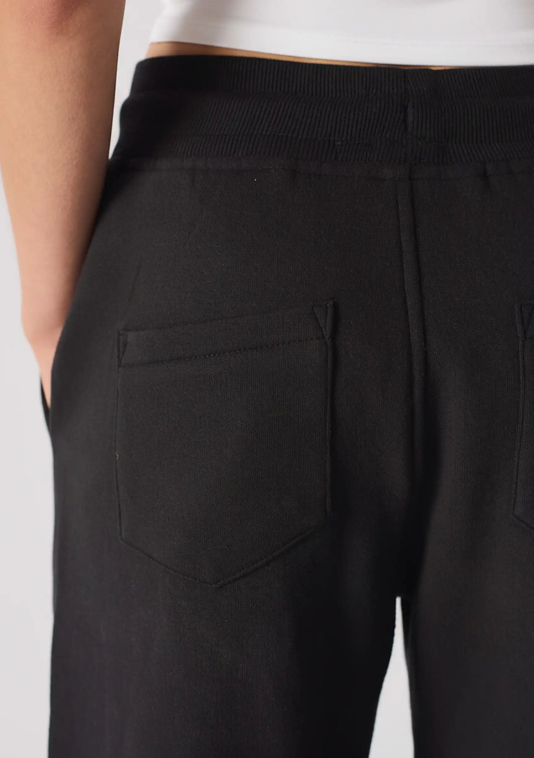 Close up of the back pocket on these premium black relaxed fit joggers womens.