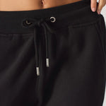 Detailed shot of the adjustable drawstring waist on the black relaxed fit joggers womens.