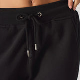 Detailed shot of the adjustable drawstring waist on the black relaxed fit joggers womens.