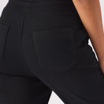 Detailed close up of the back pocket texture on black relaxed jogger