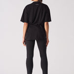 black skinny biker jeans women back view styled with oversized t-shirt