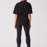 black skinny biker jeans women back view styled with oversized t-shirt