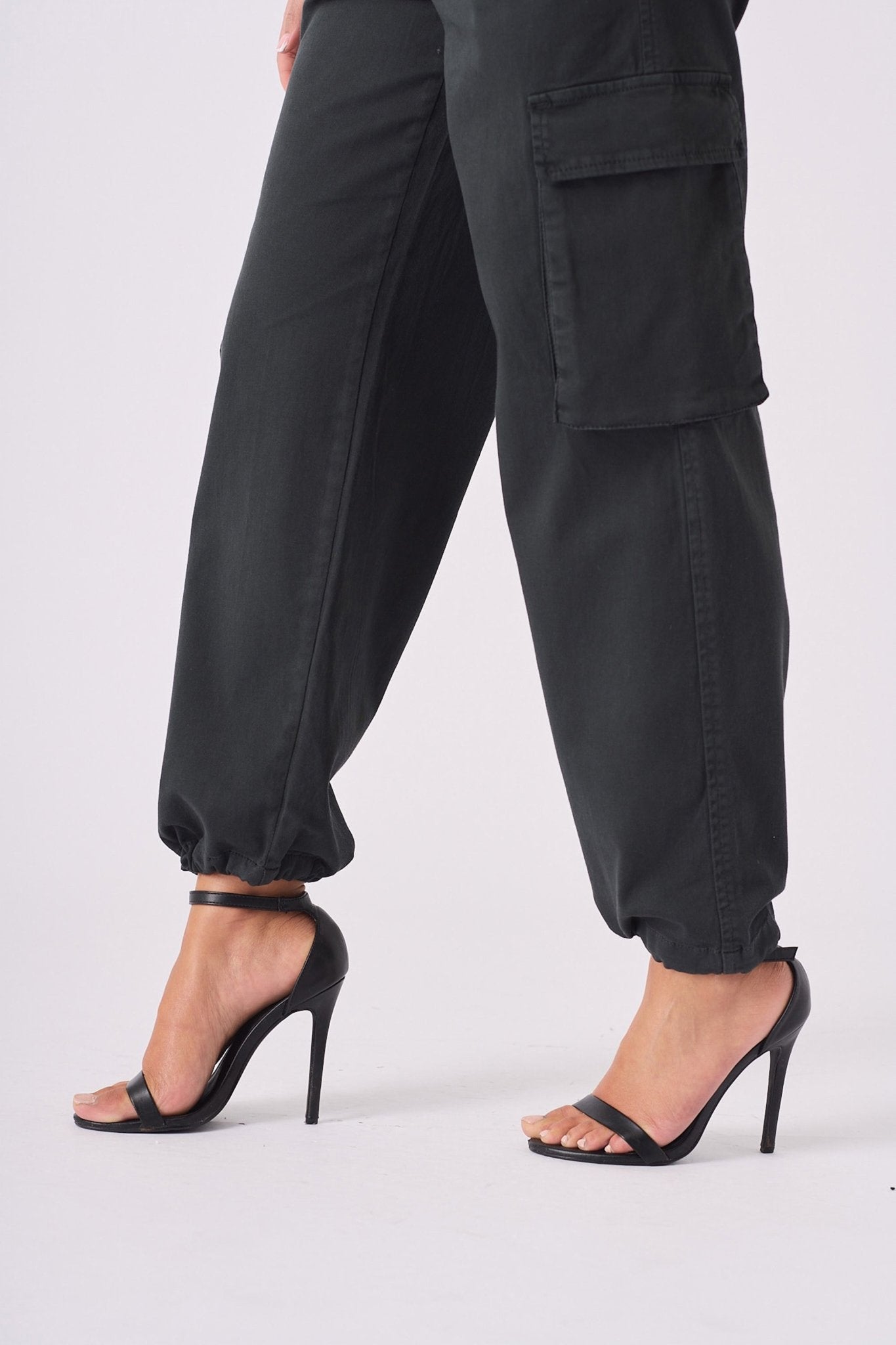 Detailed shot showing the hem and fit of black straight leg cargo pants women's.