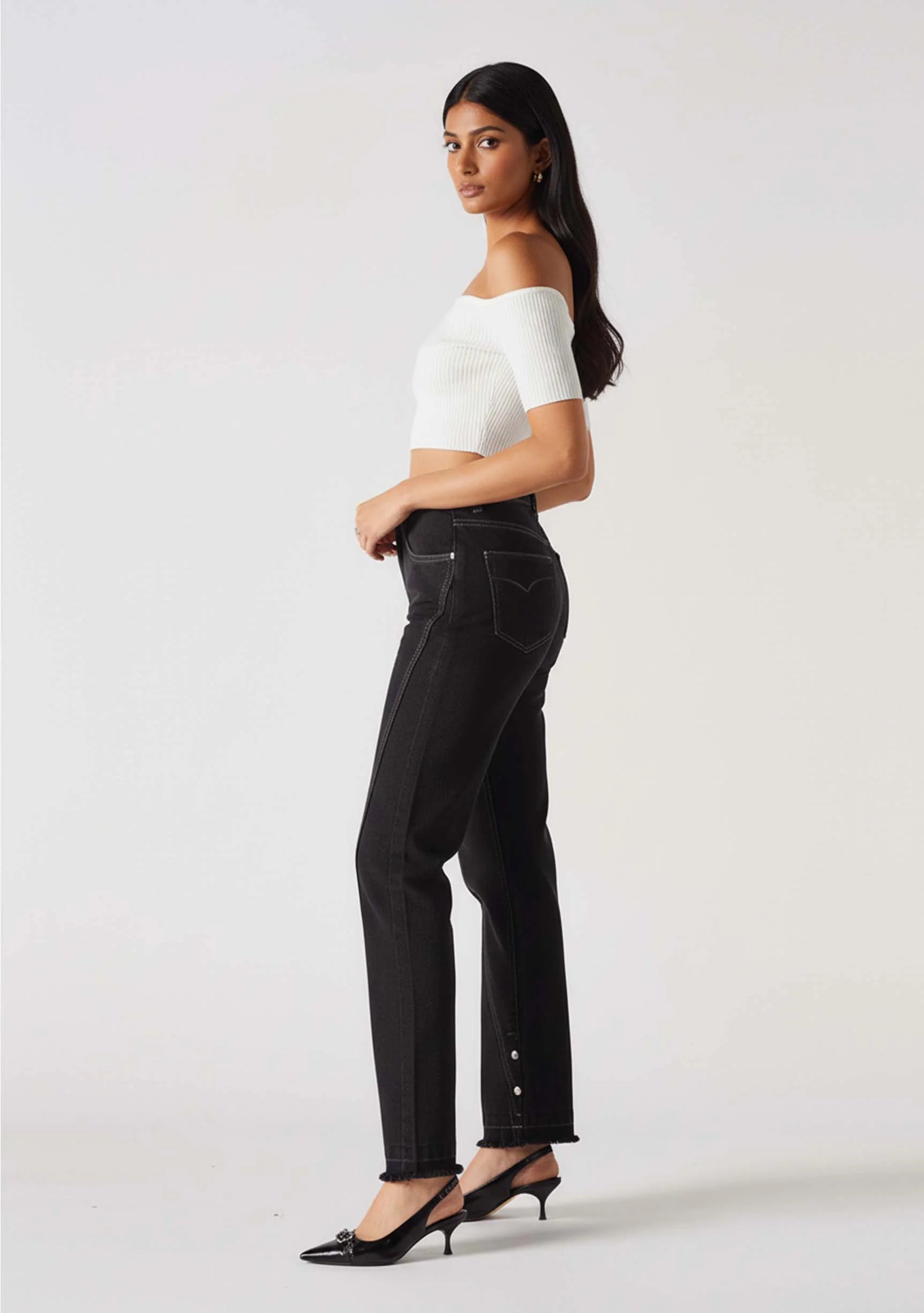 Side view showcasing the popper hem detail on Women's Black Wash Straight Leg Jeans